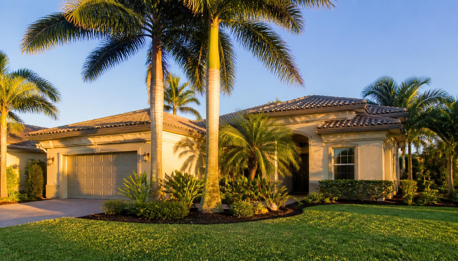 Florida single-family rental home with palm trees in warm late-afternoon light - DSCR loans for Florida real estate investors, ABS Funding